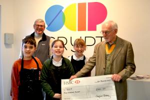 Vice President Keith Blackburn supported by Paul Vaesen, Chair Youth Services presenting the cheque to young artists representing SCIP